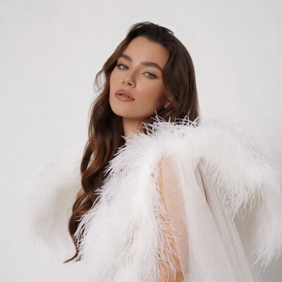 Woman in white feathered gown