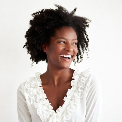 African-American woman smiling with curly hair