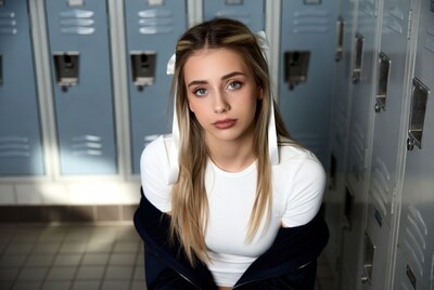 Teen girl with hair ribbons at lockers