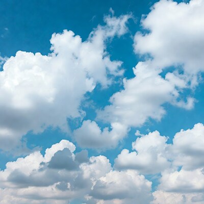 Fluffy white clouds in blue sky
