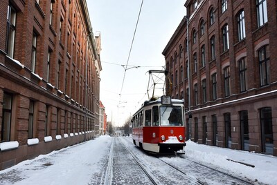 Red Tram Snowy Brick Street