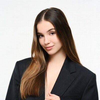 Young woman in black blazer smiling