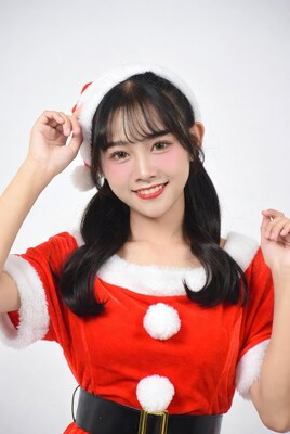 Asian girl in Santa costume smiling