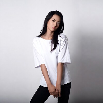 Asian woman in white shirt black pants