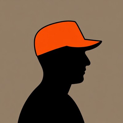 Man silhouette wearing orange cap