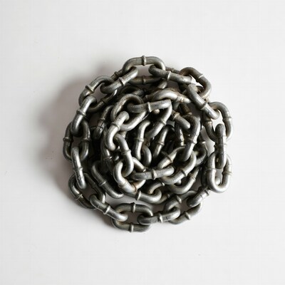 Coiled Metal Chain on White Background