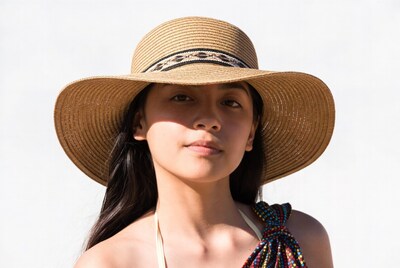 Woman wearing straw hat and bikini