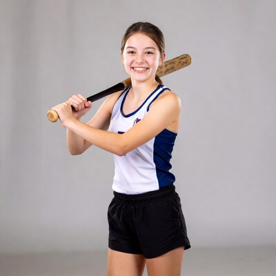 Girl swinging baseball bat