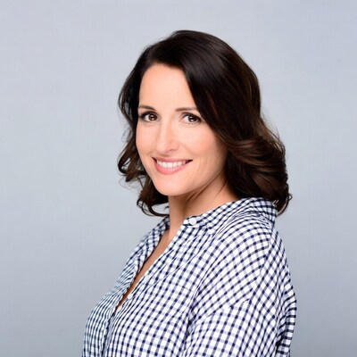 Smiling woman in checkered shirt