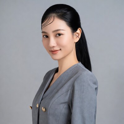 Asian woman in gray blazer
