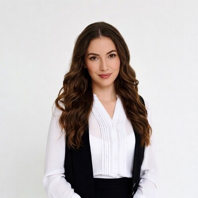 Woman in white blouse black vest