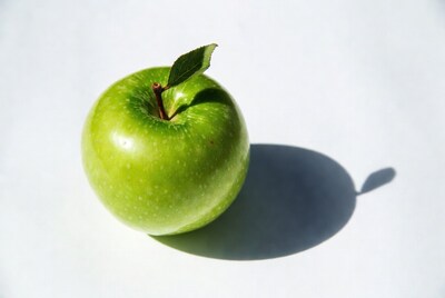 Green apple with leaf
