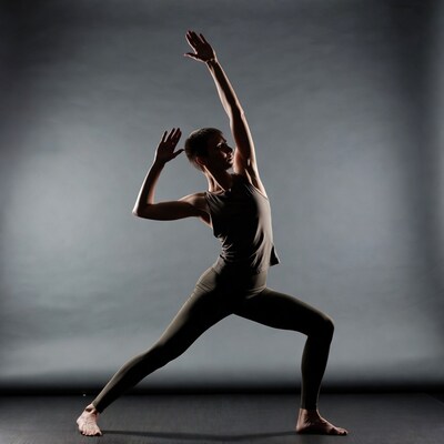Woman performing warrior yoga pose