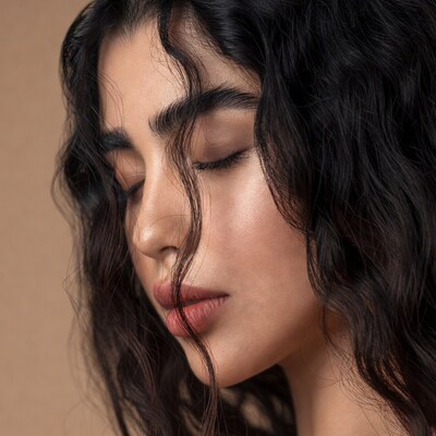 Closeup of woman with curly black hair