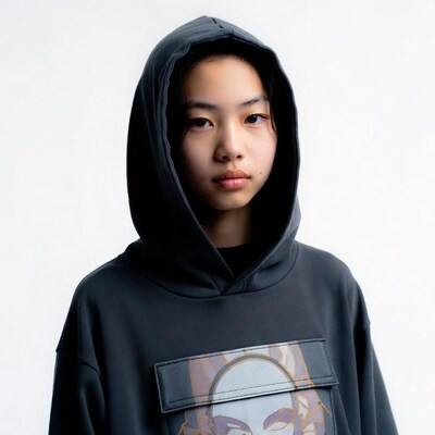 Asian girl in hoodie with face print