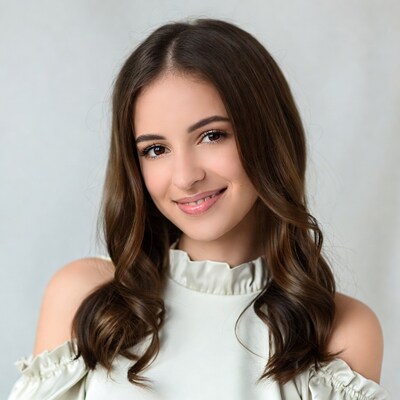 Smiling young woman in off-shoulder top