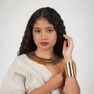 Young woman with gold necklace and bracelet