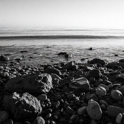 Black and white rocky beach waves