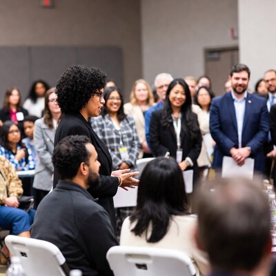 African-American woman speaking at conference