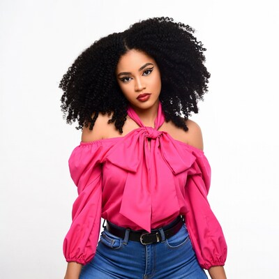 African-American woman in pink off-shoulder top