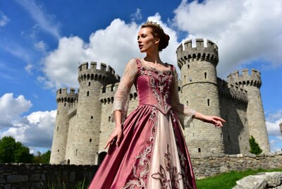 Woman in pink gown at castle