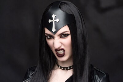 Gothic woman snarling in leather mask
