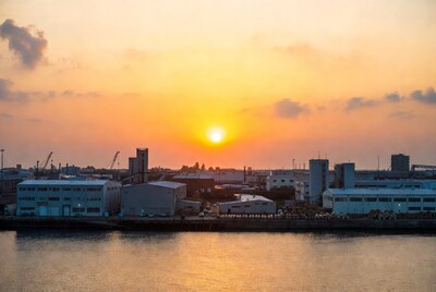 Sunset over industrial harbor