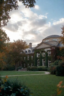 Ivy-covered historic mansion in autumn