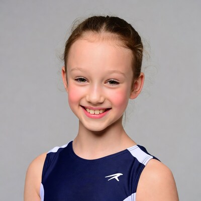 Smiling girl in gymnast leotard