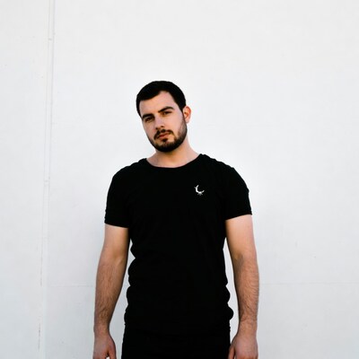 Man in black t-shirt with moon logo