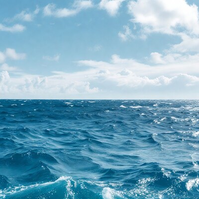 Ocean waves under blue sky