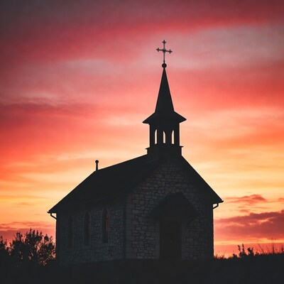 Silhouette chapel sunset cross