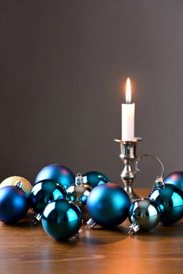 Blue Christmas Ornaments and Lit Candle