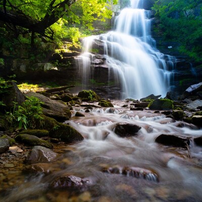 Waterfall cascading over mossy rocks