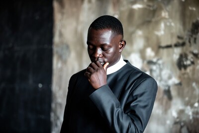 African-American man in clerical collar thinking