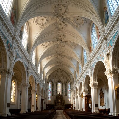 Empty ornate church interior with pews