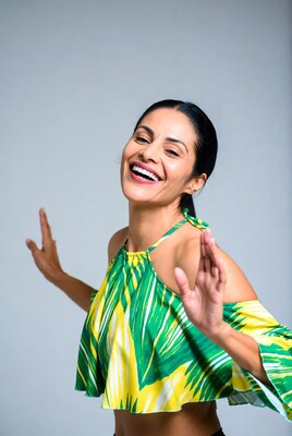 Woman laughing in green crop top
