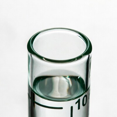 Glass graduated cylinder with water