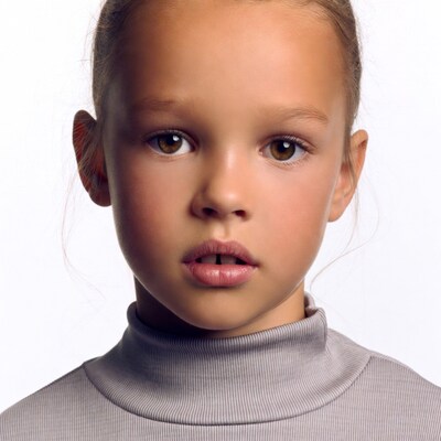 Young girl with ponytail in turtleneck