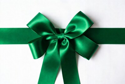 Green satin bow on white background