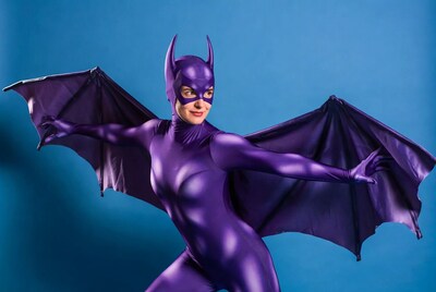 Woman in Batgirl costume with wings