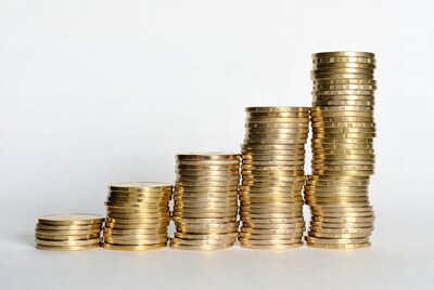 Stacks of gold coins ascending