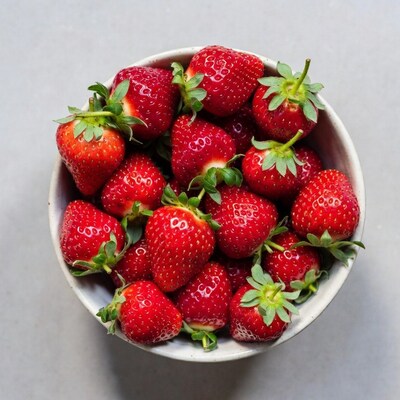 Fresh strawberries in white bowl