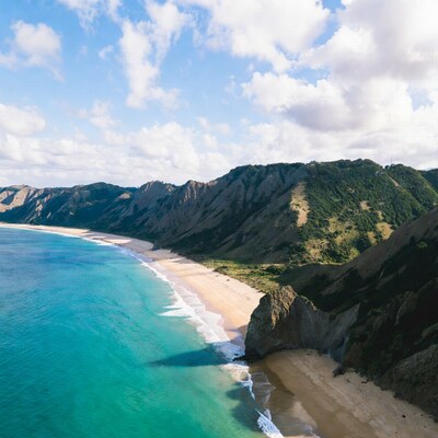 Cliff-lined beach with turquoise ocean