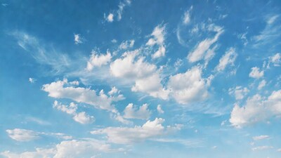Fluffy white clouds in blue sky