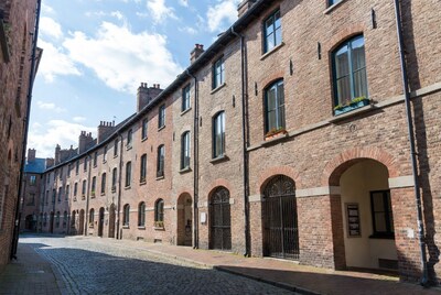 Curved Brick Terraced Houses on Cobblestone Street