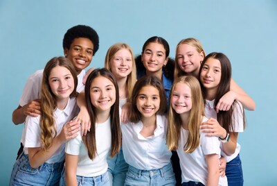 Diverse group of teens hugging