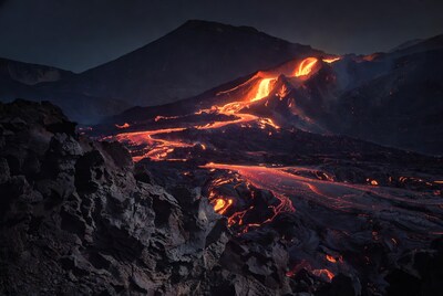 Glowing Lava Flowing Down Volcano