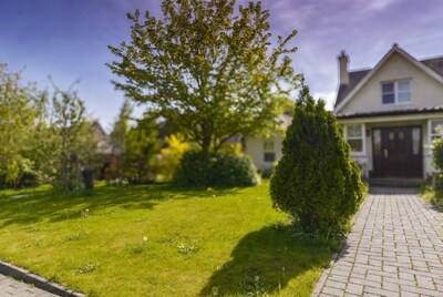 Cream house with garden and pathway