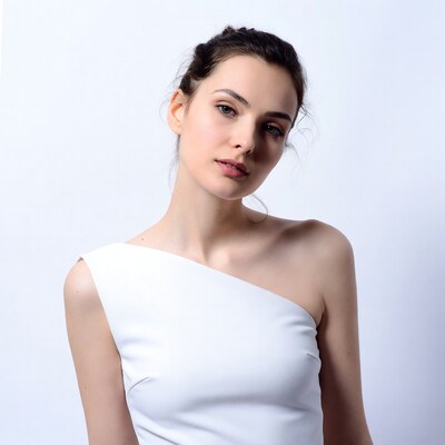 Woman in white one-shoulder dress